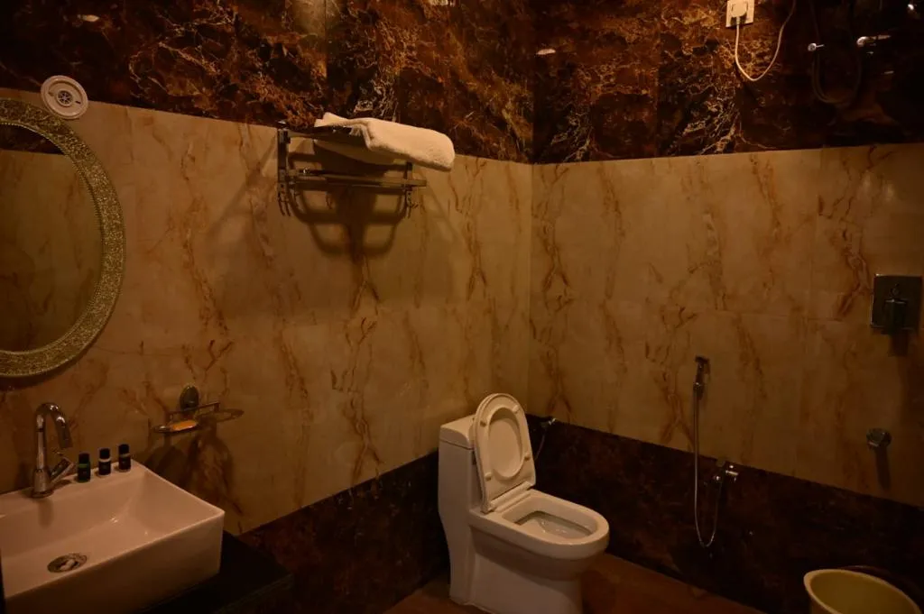 Clean Attached Bathroom At Hotel Raghuveer - Yatra Service